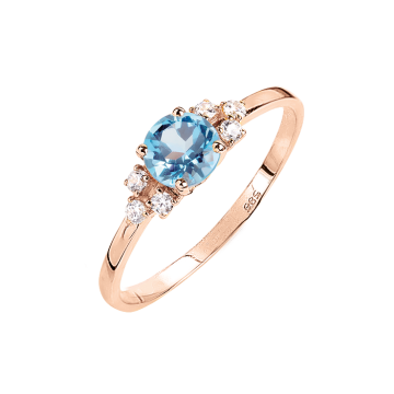 Lady´s ring in red gold of 585 assay value with blue topaz, zirconia 